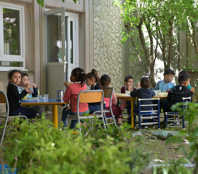 Children eating in a garden